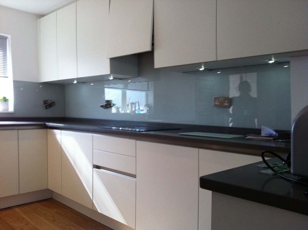 Grey glass kitchen splashback with LED lighting in Sydenham