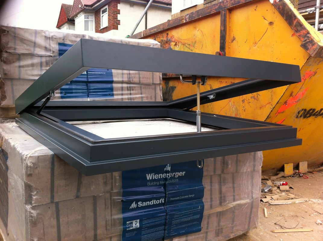 Opening flat roof skylight in anthracite grey installed in Sydenham