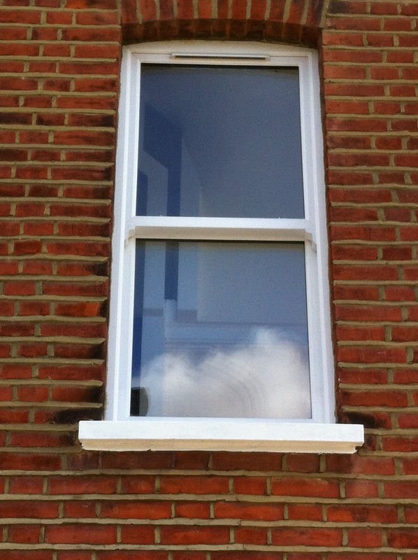 uPVC sash window on Victorian red brick house in Sydenham